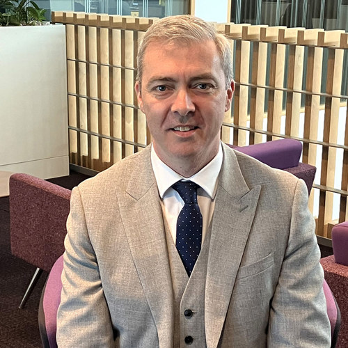 A picture of managment member Alex Flucker